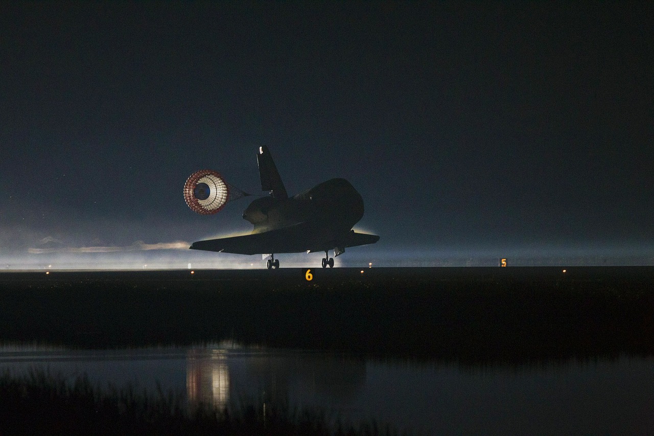 space shuttle atlantis landing drag chute deployed free photo