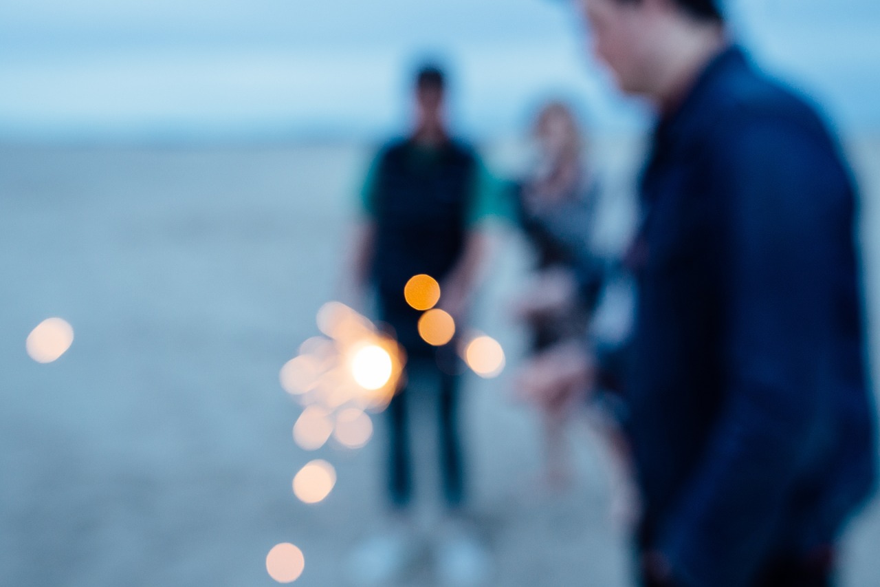 sparkler people beach free photo