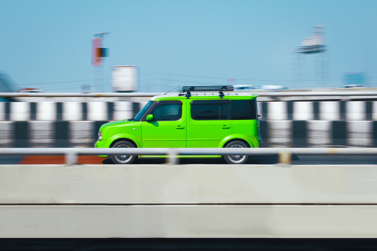 speed car  green  road free photo