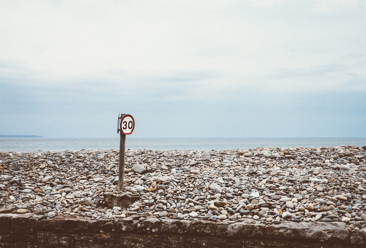 speed limit rocks ocean free photo