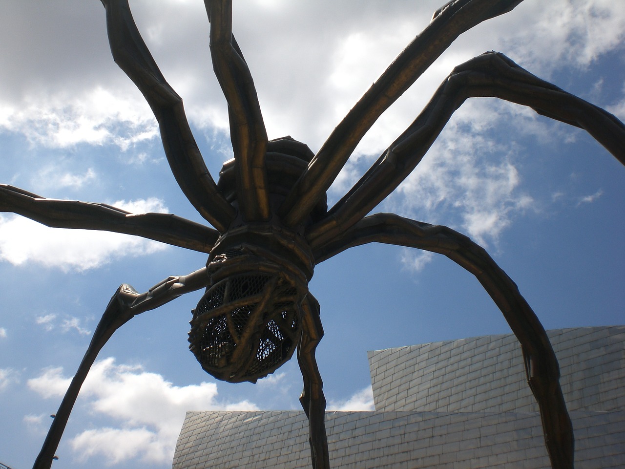 giant spider insect sculpture free photo