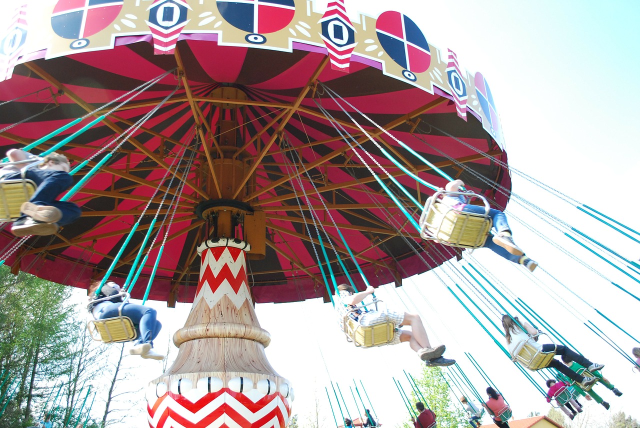 spinning amusement park swings free photo