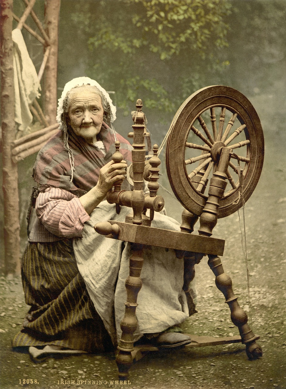 spinning wheel woman old free photo