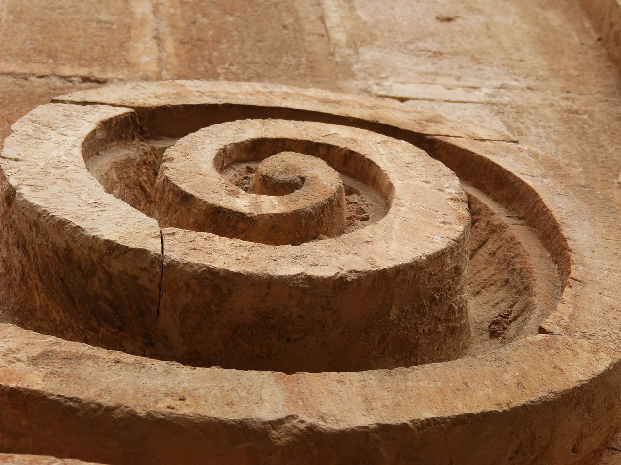 spiral carved stone church free photo