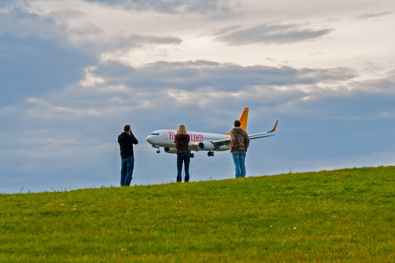 spotting landing aircraft free photo