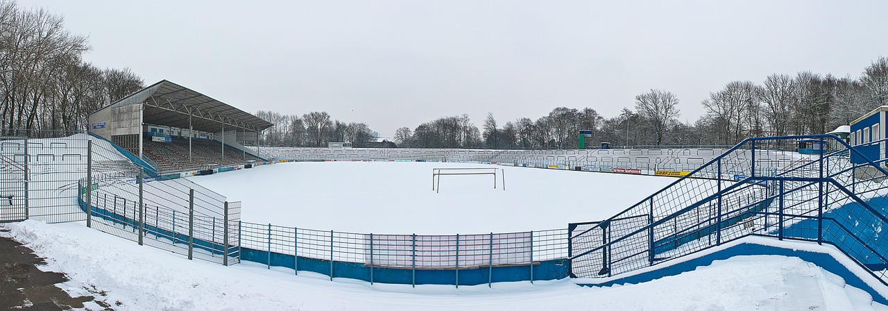 stadium football pitch snow free photo