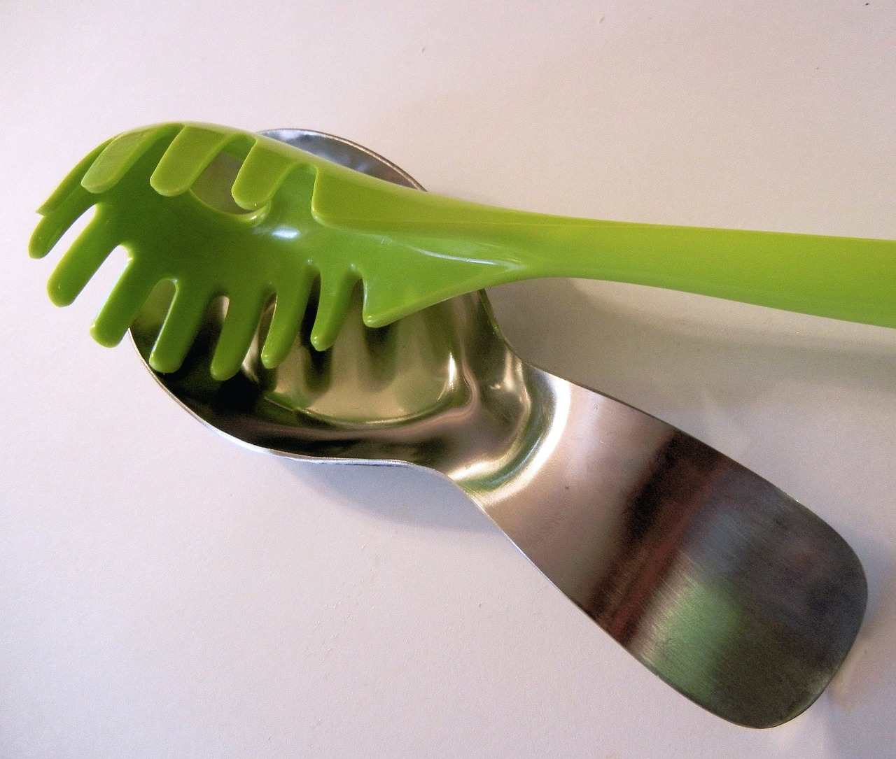 stainless spoon rest green plastic utensil spaghetti spoon free photo