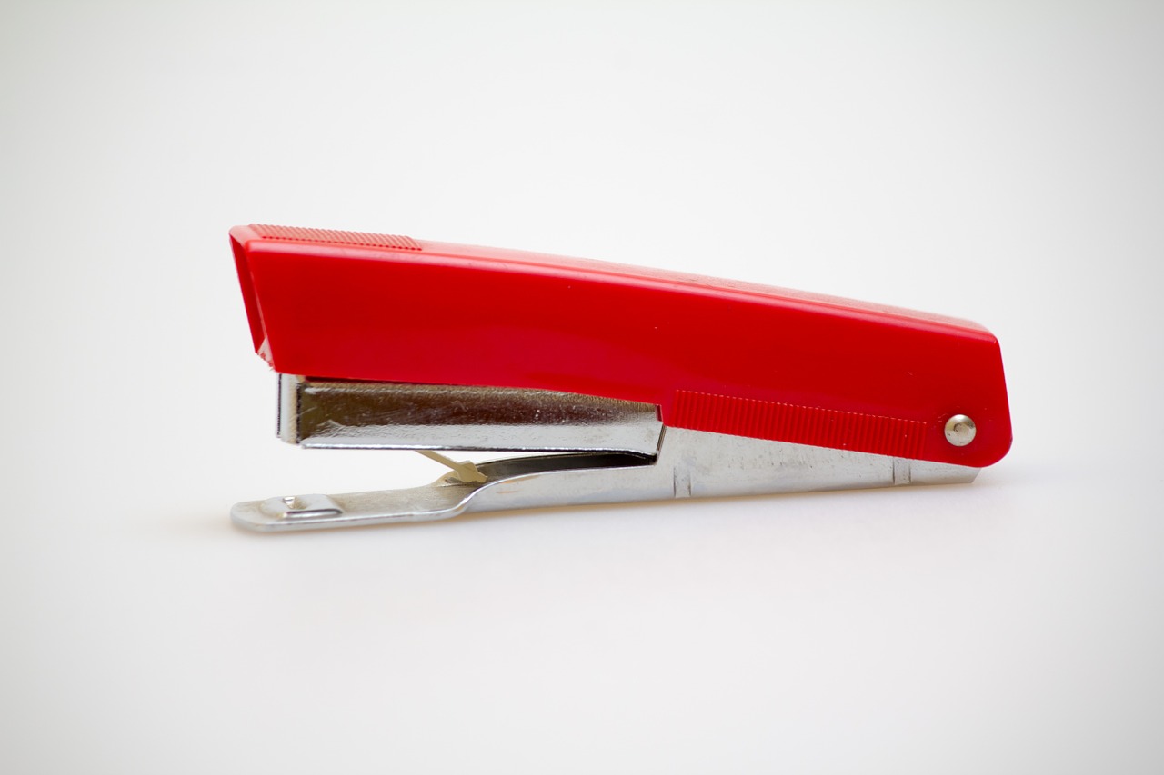 stapler red stock photography free photo