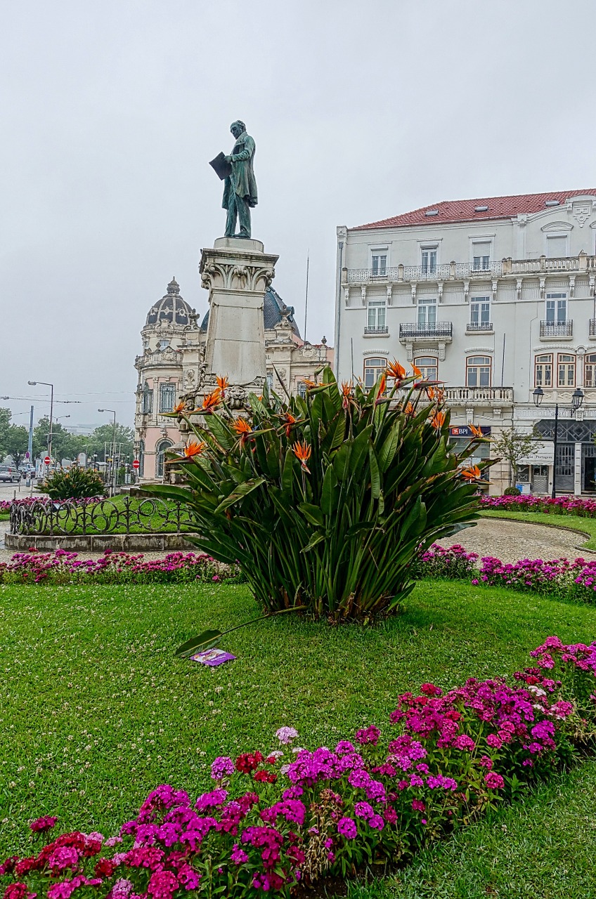 statue urban flowers free photo