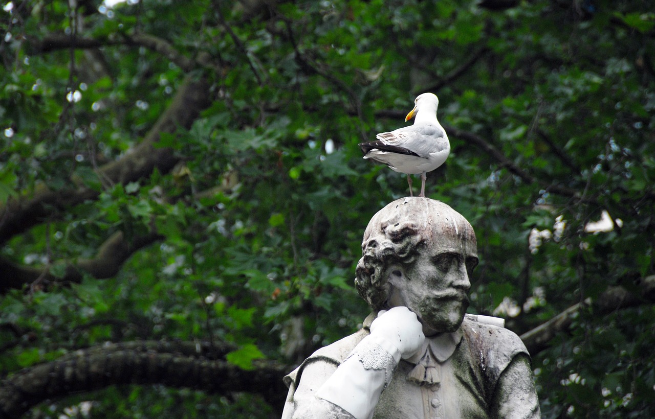 statue park bird free photo