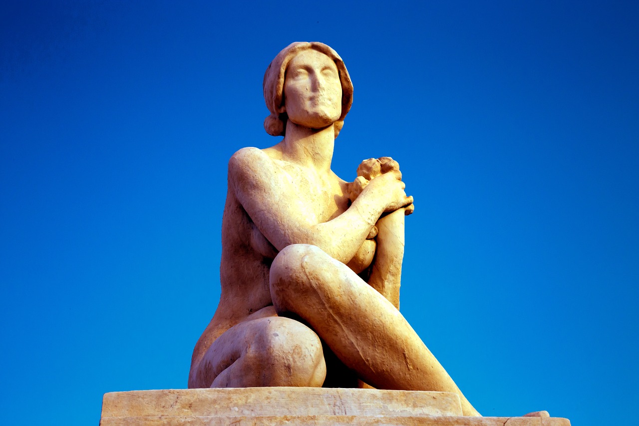 statue woman sky free photo