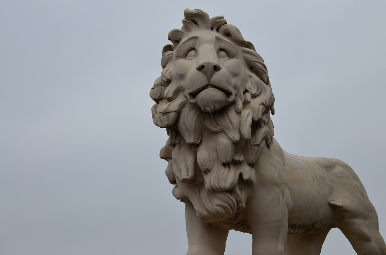 statue lion sky free photo