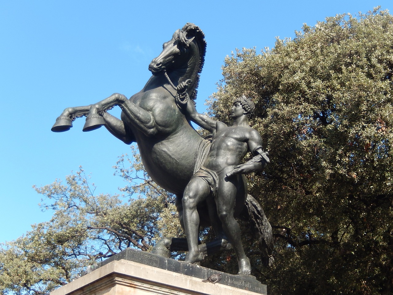 the man with the horse statue barcelona free photo