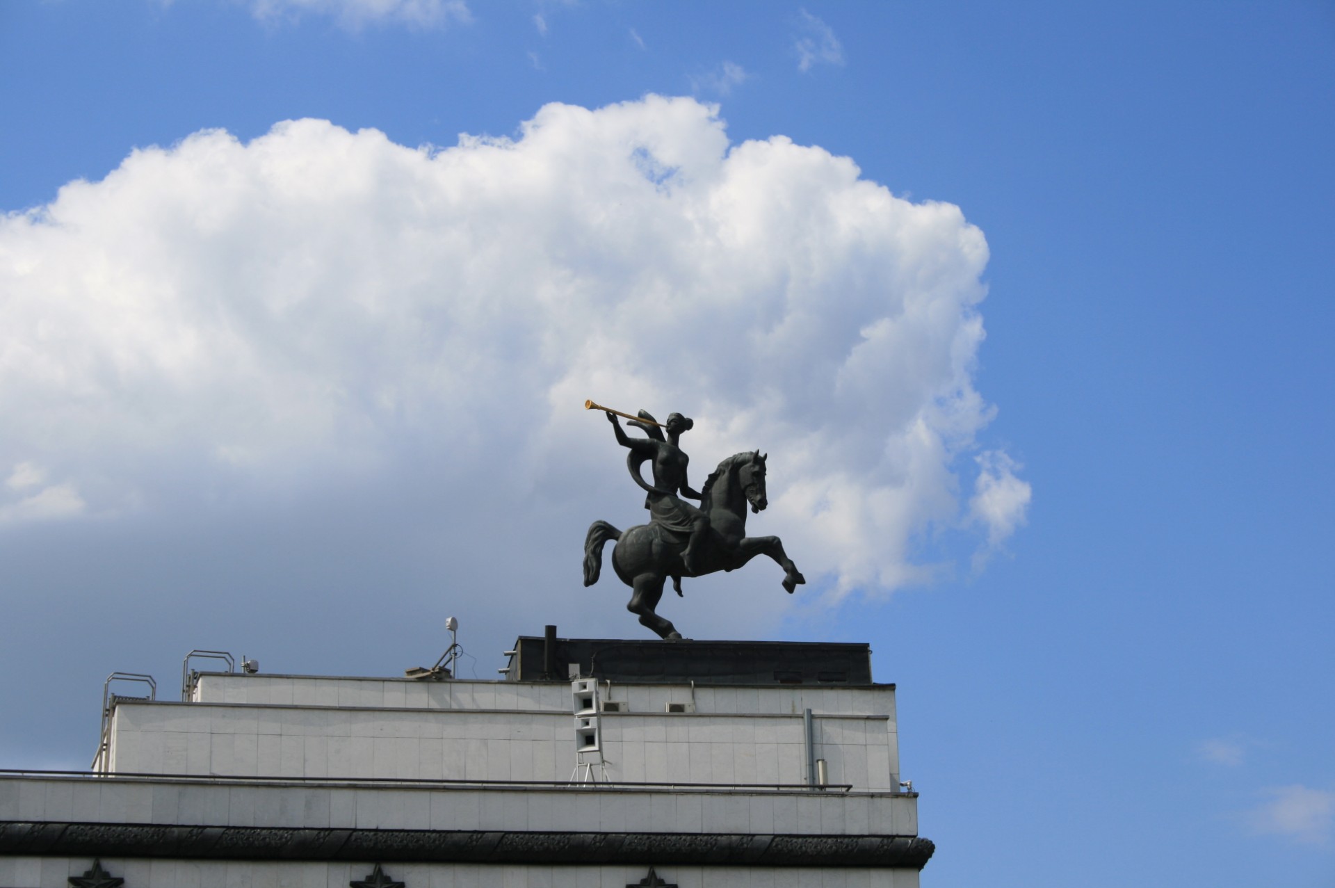 statue woman rearing horse blowing golden trumpet free photo