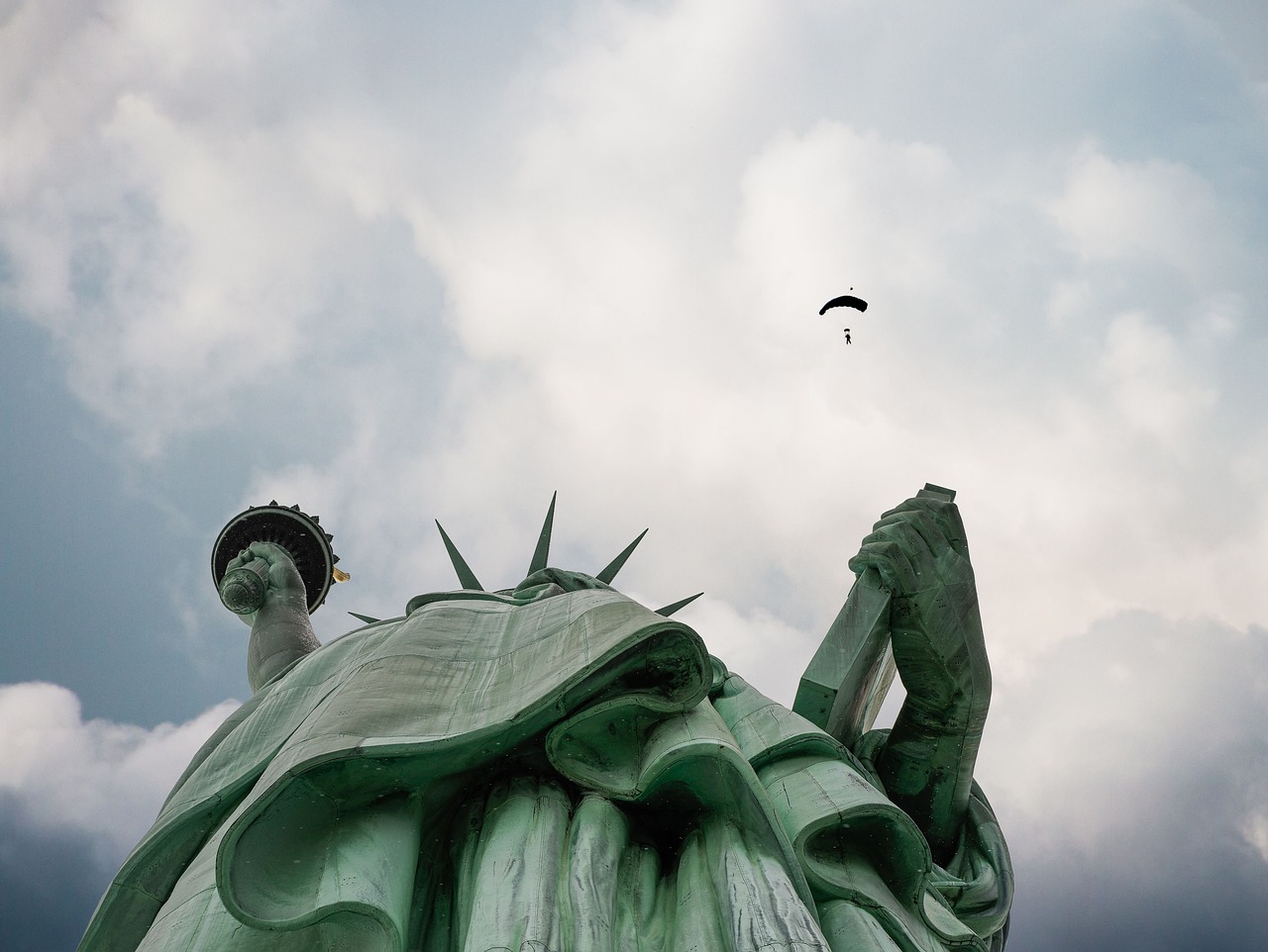 statue of liberty clouds liberty enlightening the world free photo