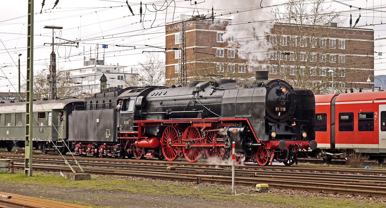 steam locomotive exit railway station free photo