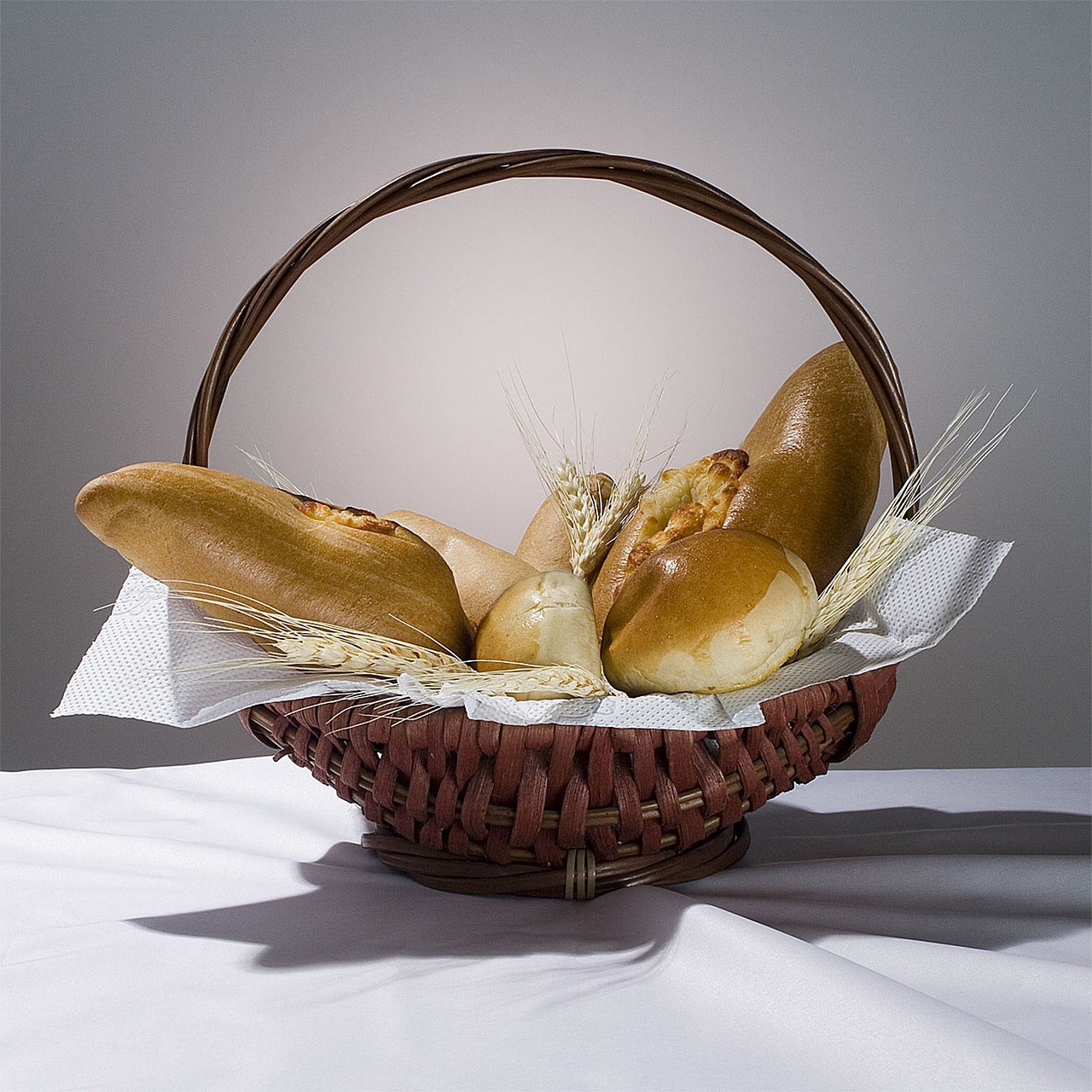 still life basket with breads free photo