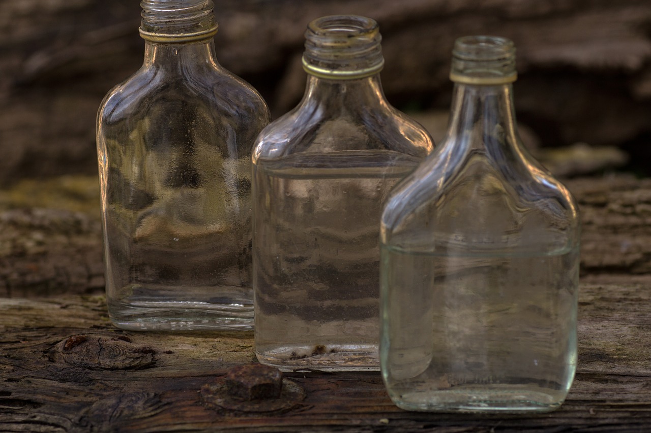 still life wooden board bottles free photo