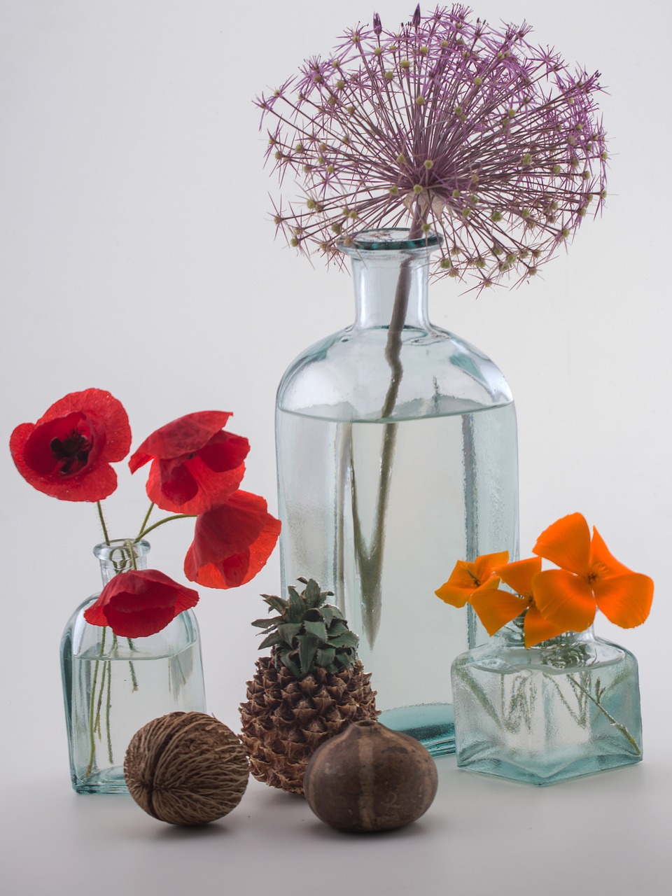 still life bottles flowers free photo