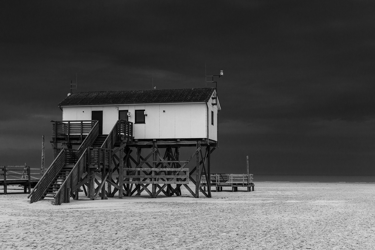 stilt house  beach  sand free photo
