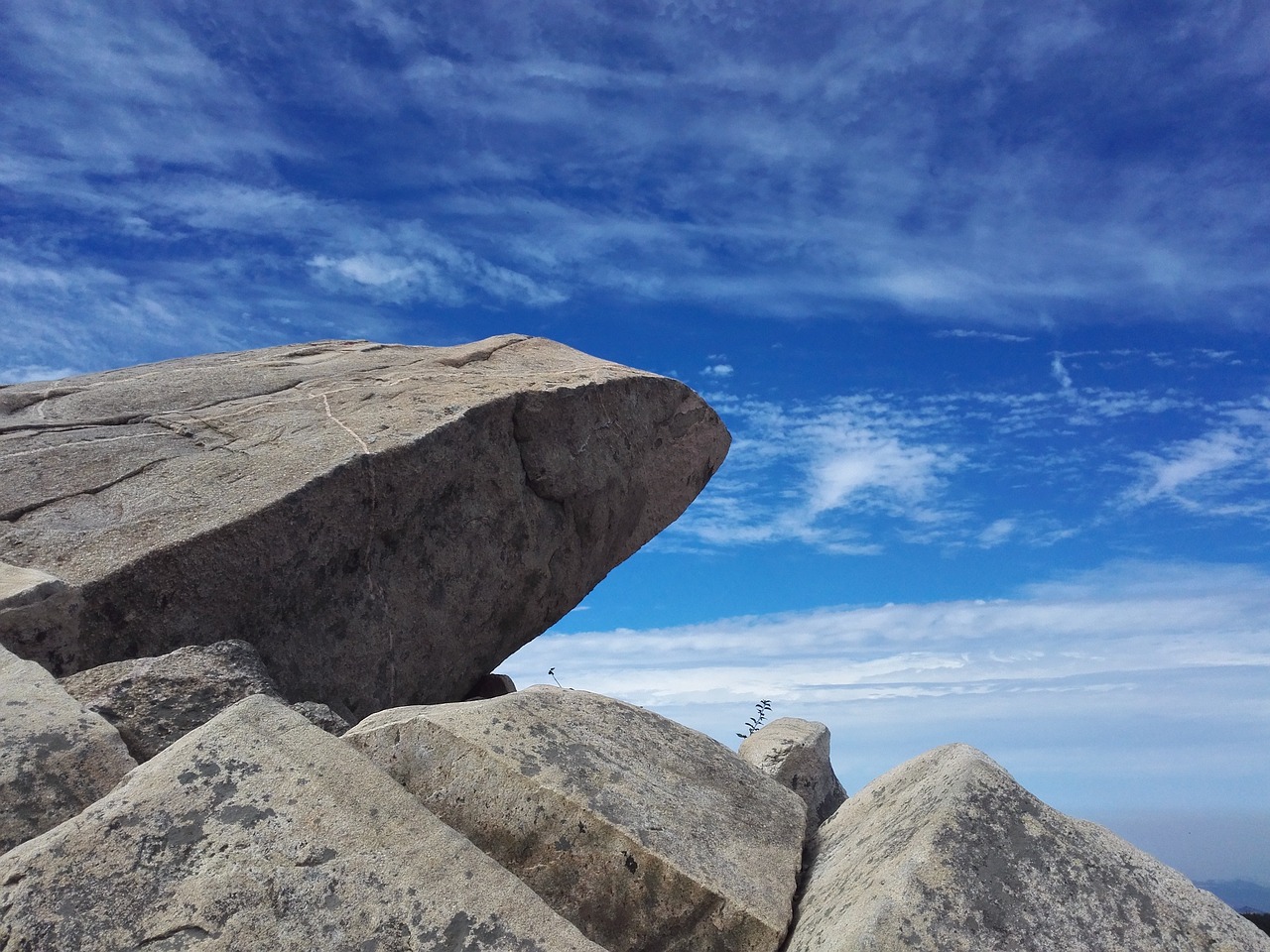 stone blue sky the clouds free photo