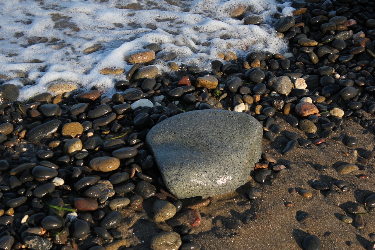 stones shingle beach foam free photo