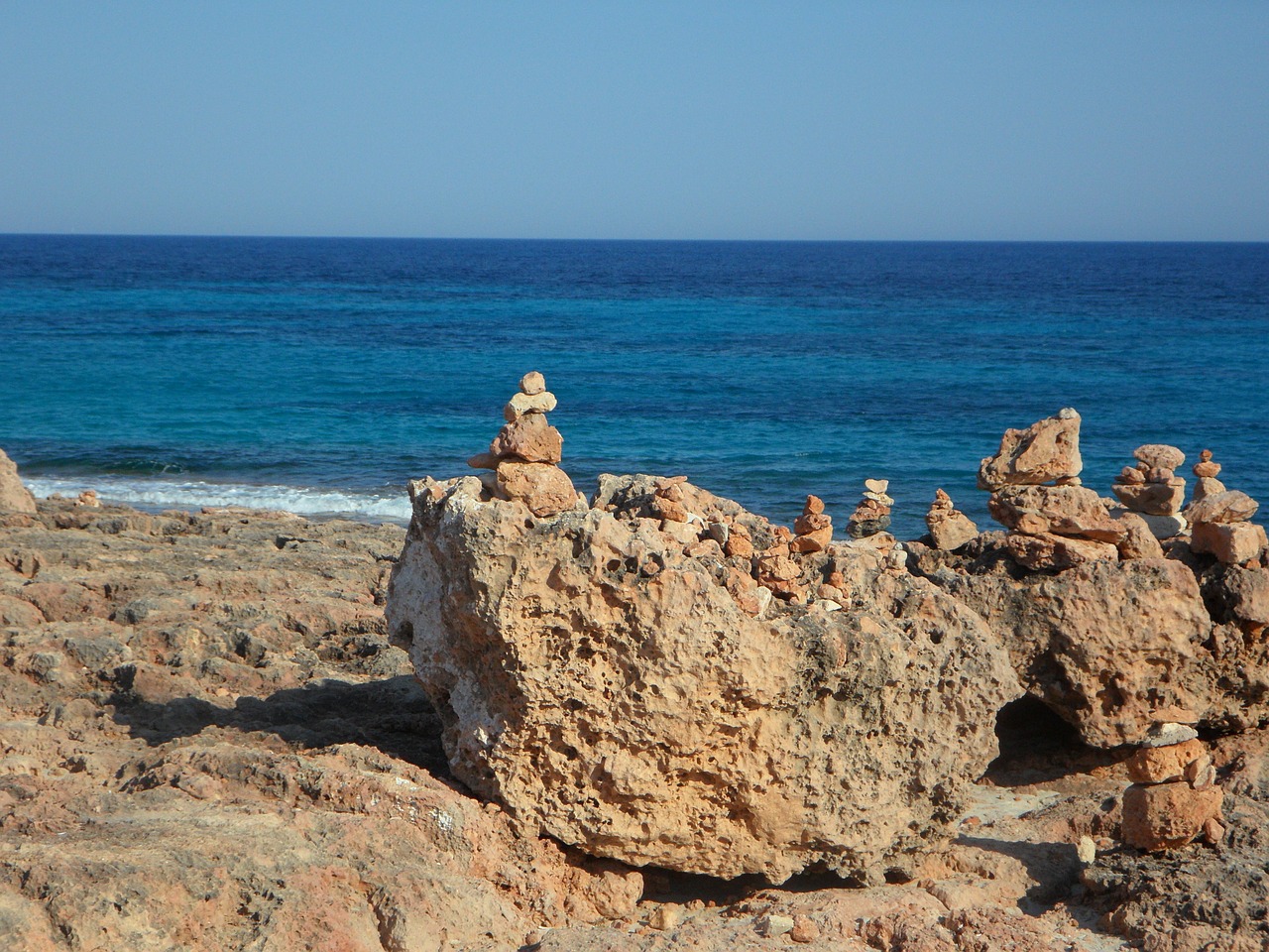 stone art cairn stone tower free photo