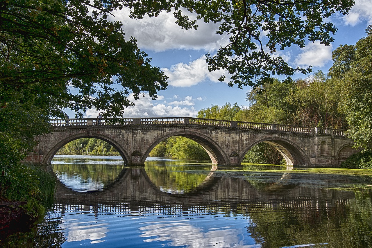 stone bridge peaceful water free photo