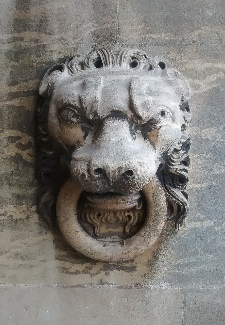stone carving lion lion's head free photo