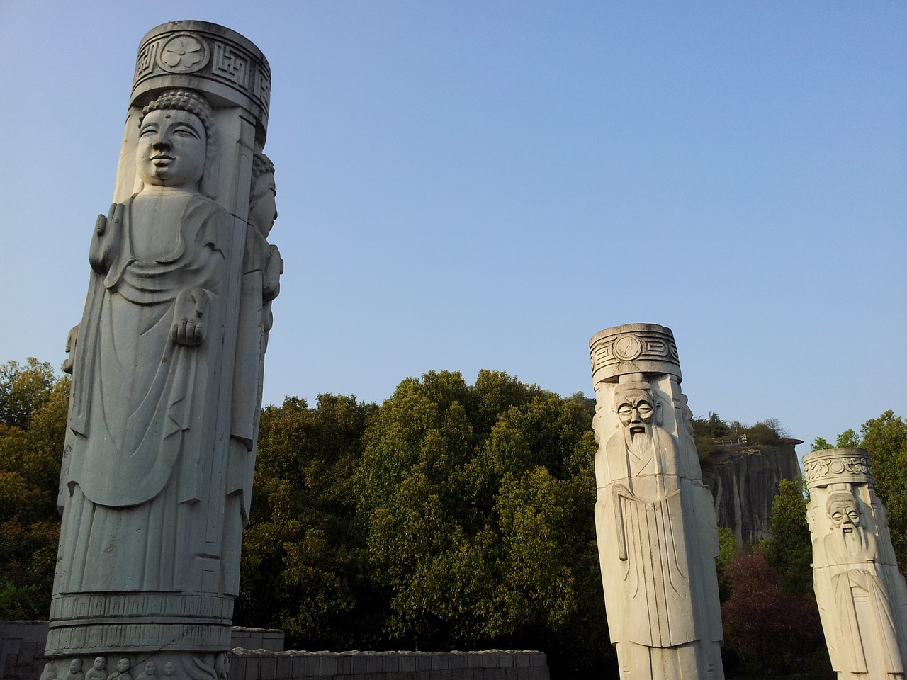 stone pillars sculpture symbol free photo