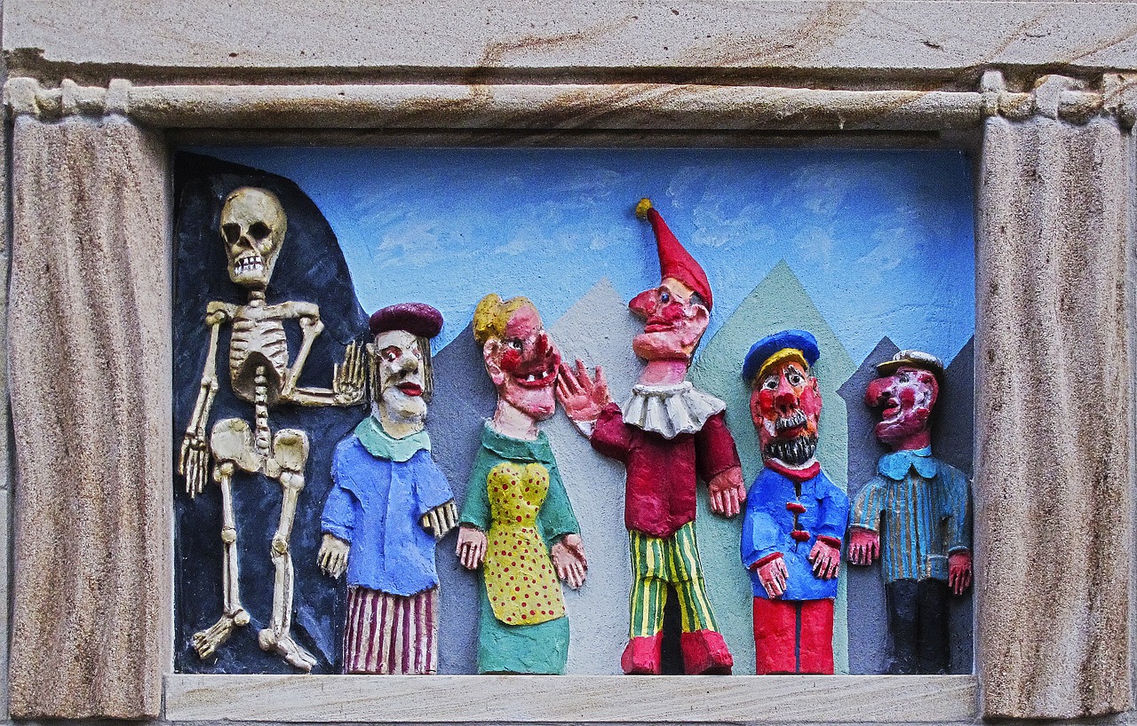 stone relief a punch and judy show punch free photo