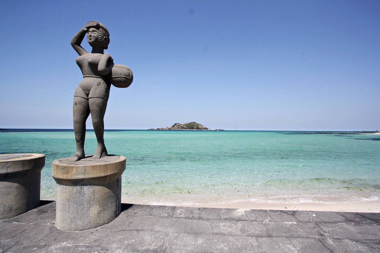 stone statue sea bathing beach free photo