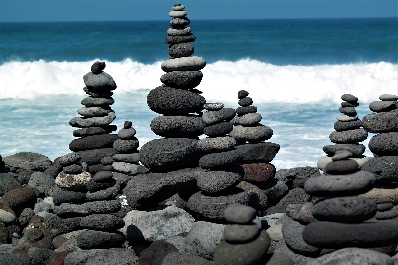 stone tower  beach  water free photo