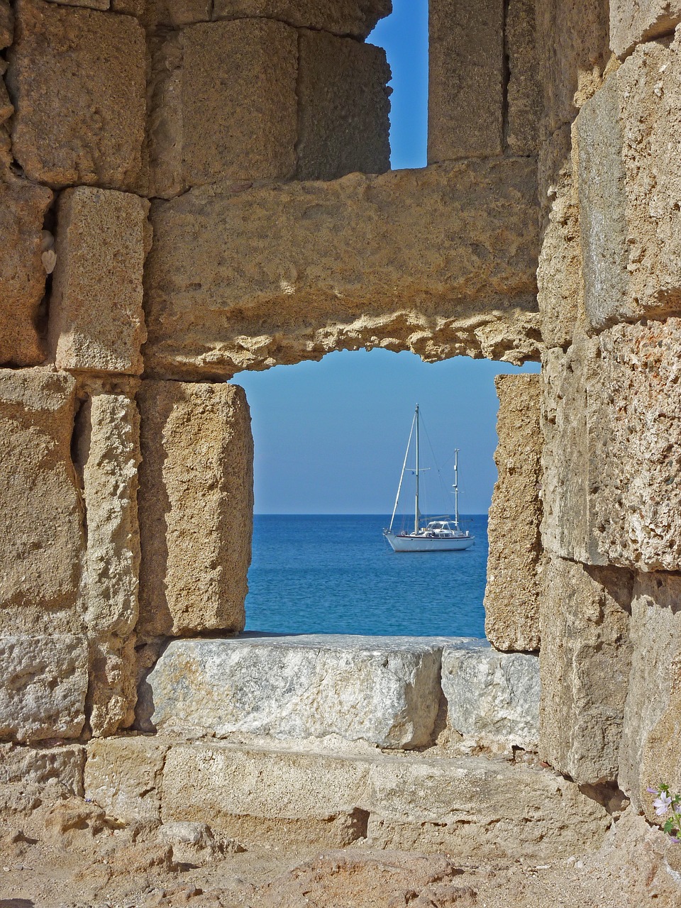 stone wall  sea  boat free photo