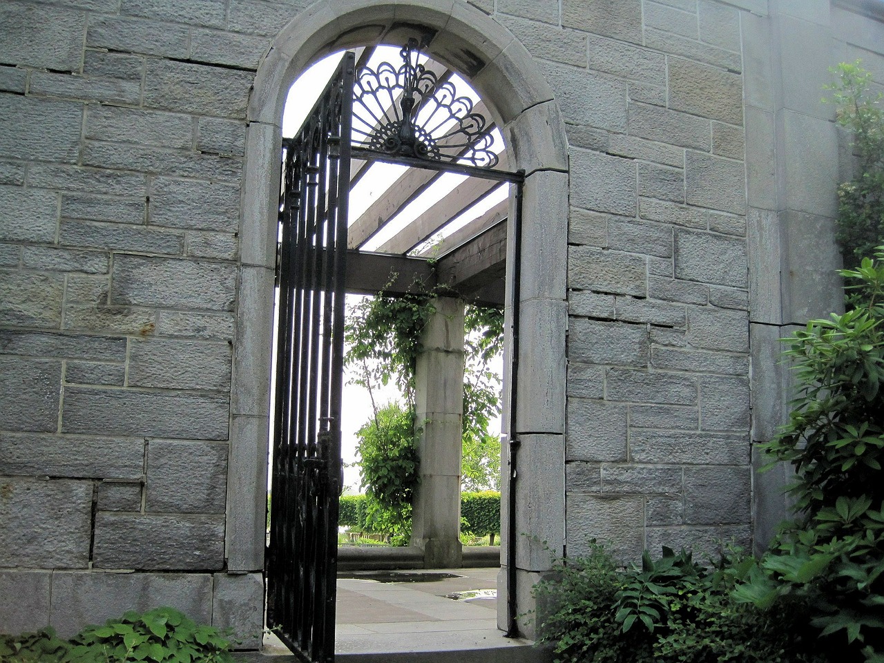 stone wall arched gate free photo