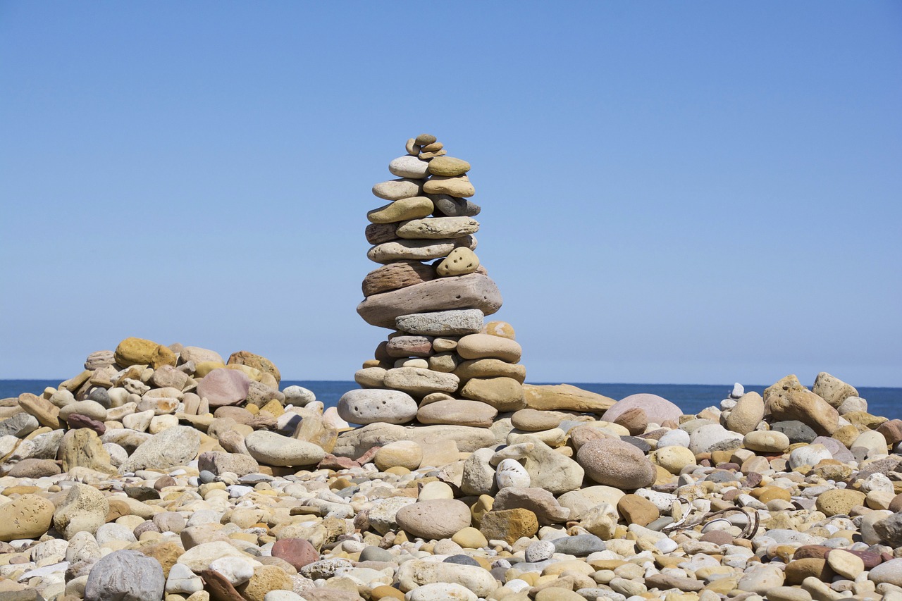 stones pile beach free photo