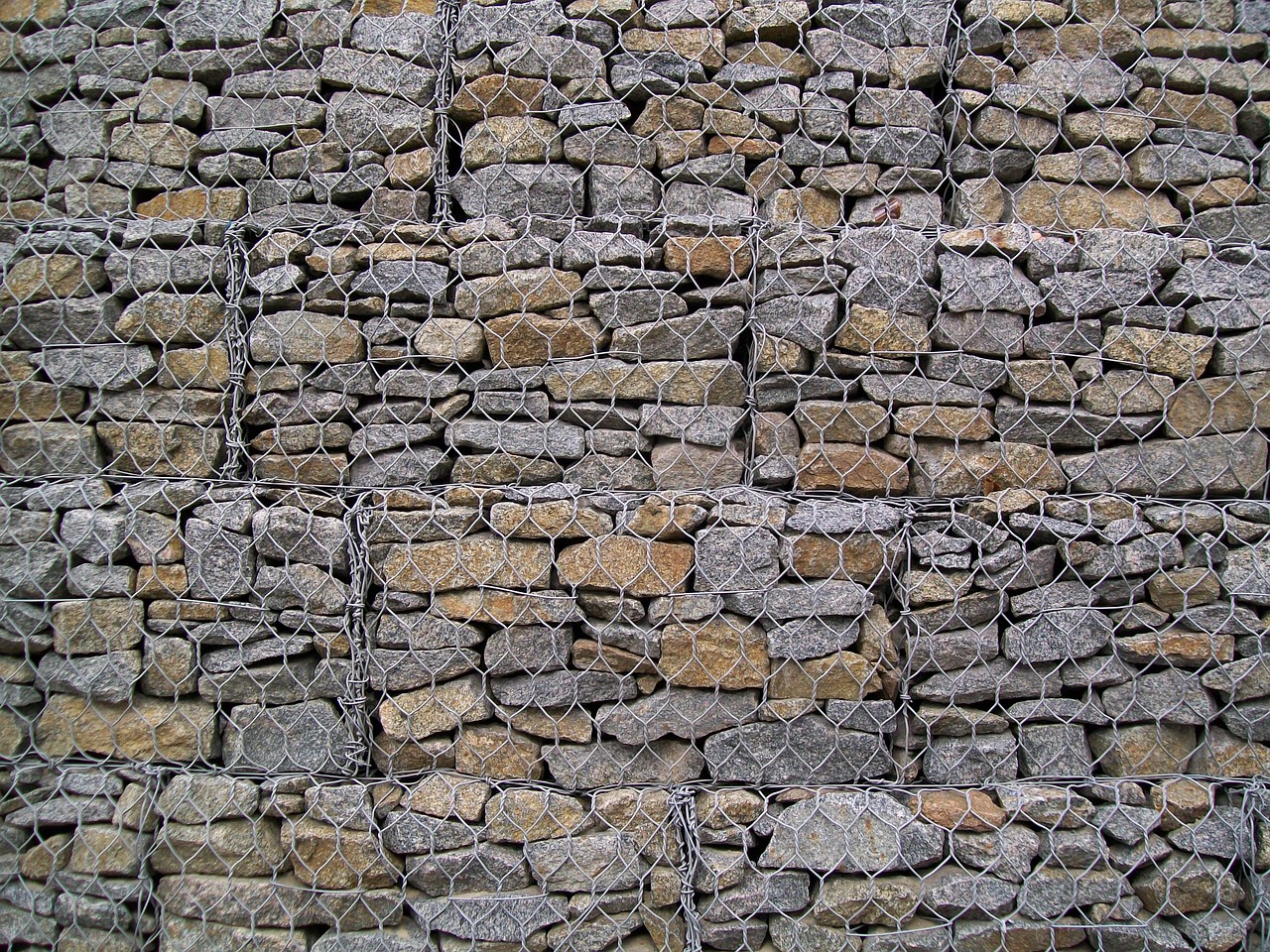 stones fence metal mesh free photo