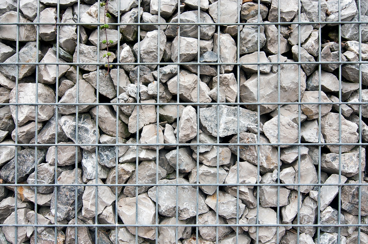 stones  behind bars  grid free photo