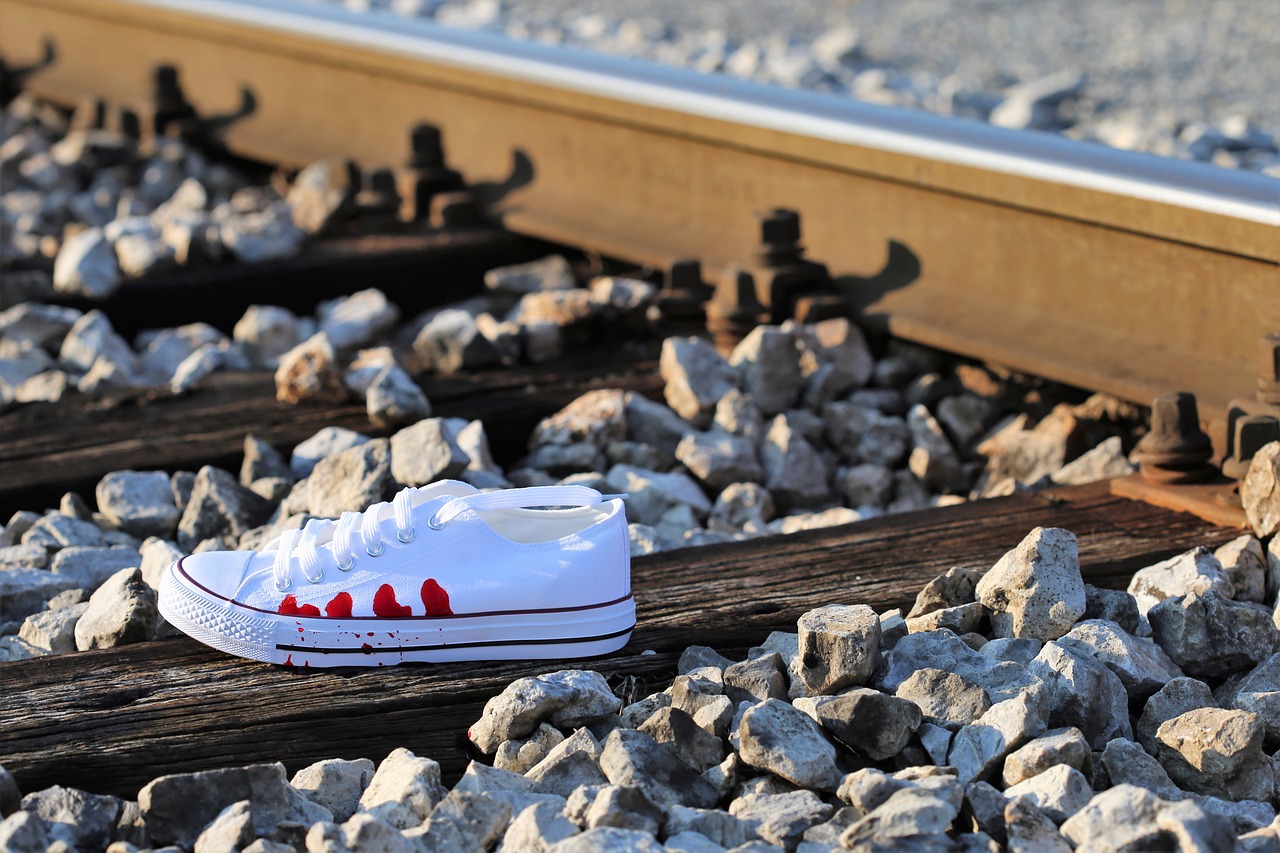 stop teenager suicide bloody sneaker on railway remembering kids and teens free photo