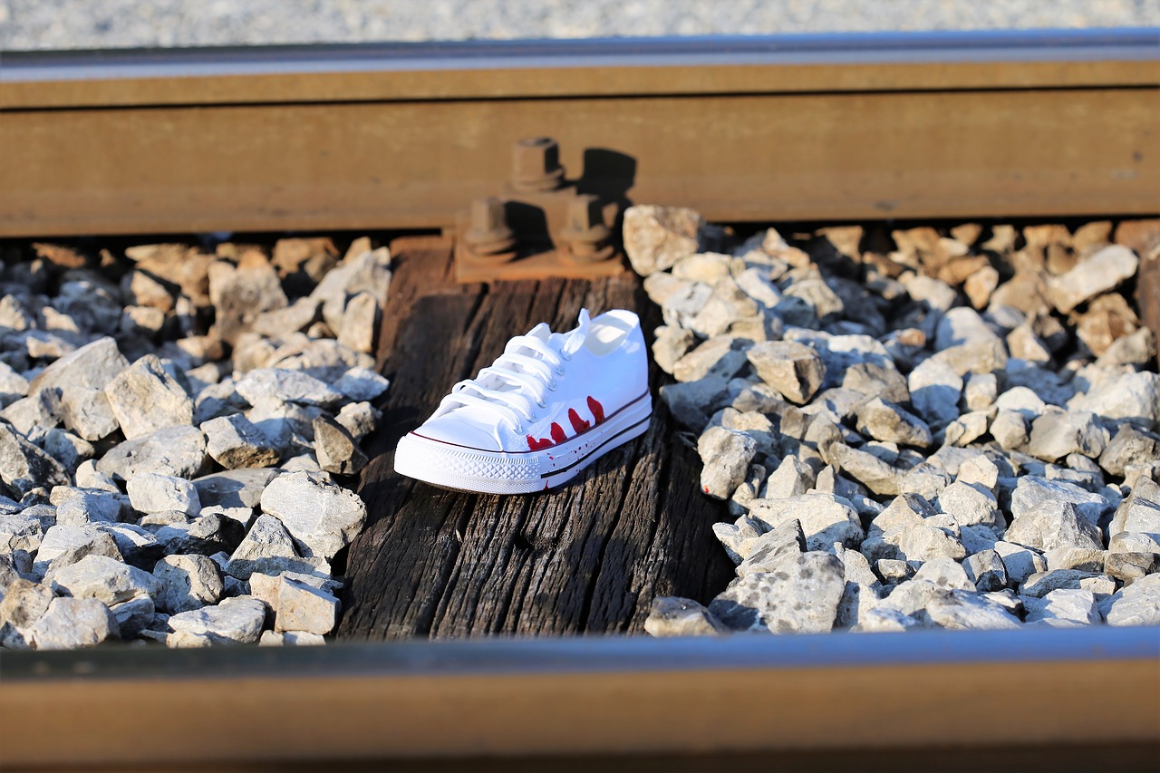 stop teenager suicide bloody sneaker on railway remembering kids and teens free photo