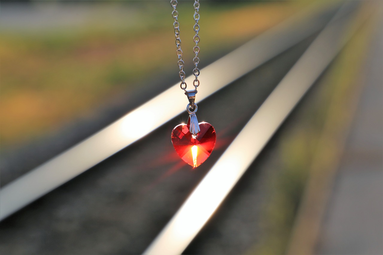 stop youth suicide  red heart medallion on railway  for all kids and teens free photo