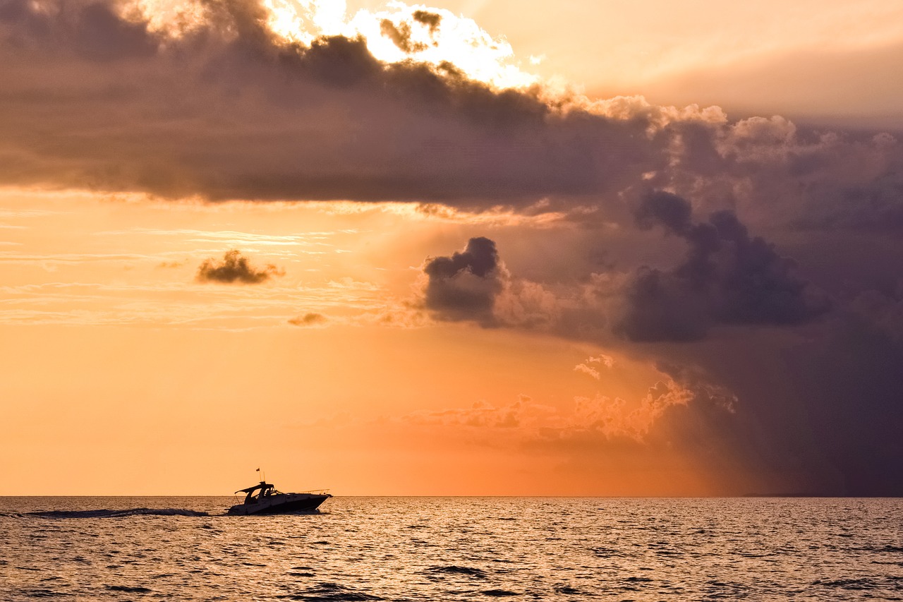 storm sunset boat free photo