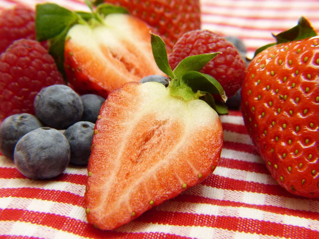 strawberries blueberries raspberries free photo
