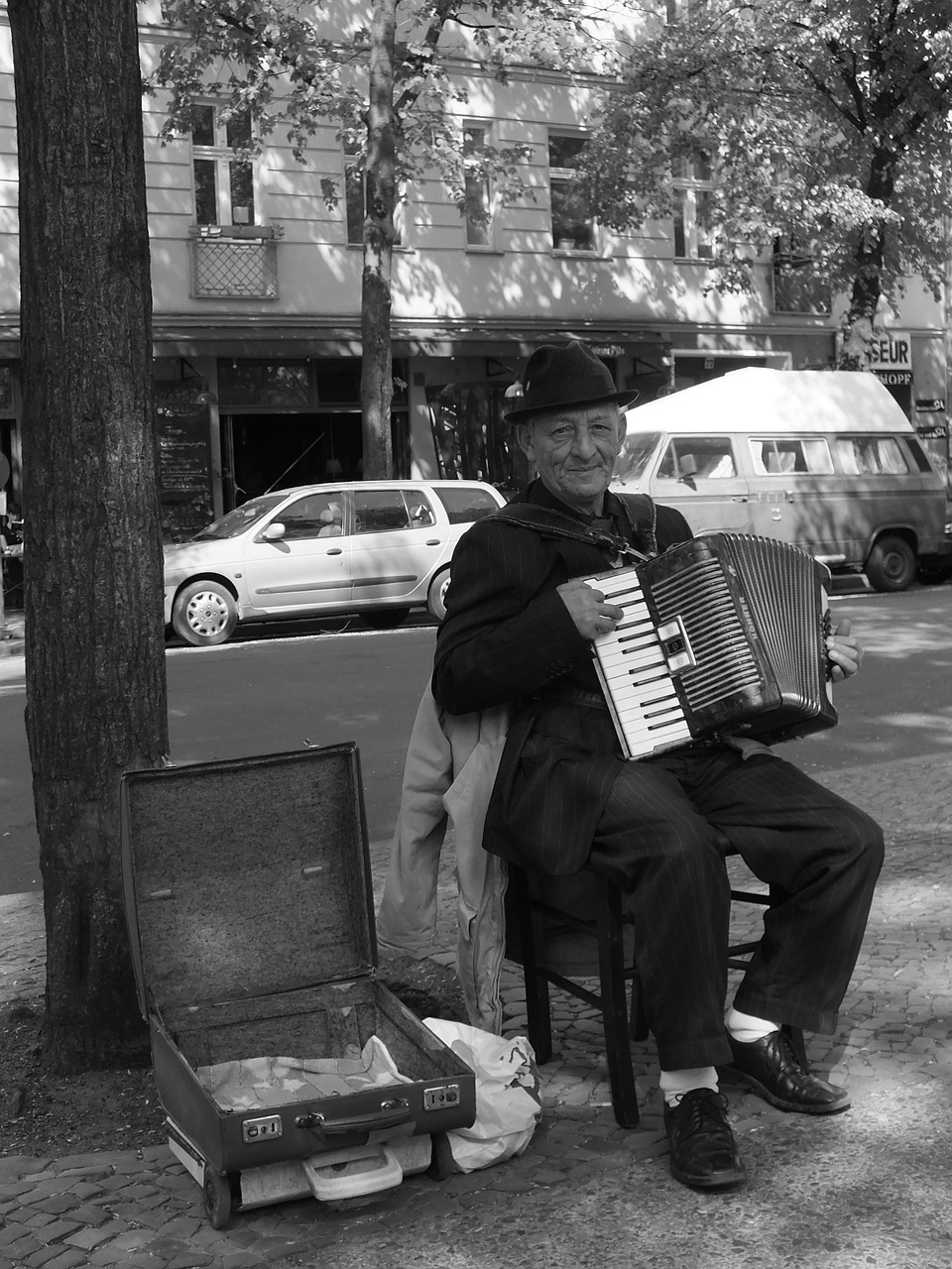 street musicians accordion player older gentleman free photo