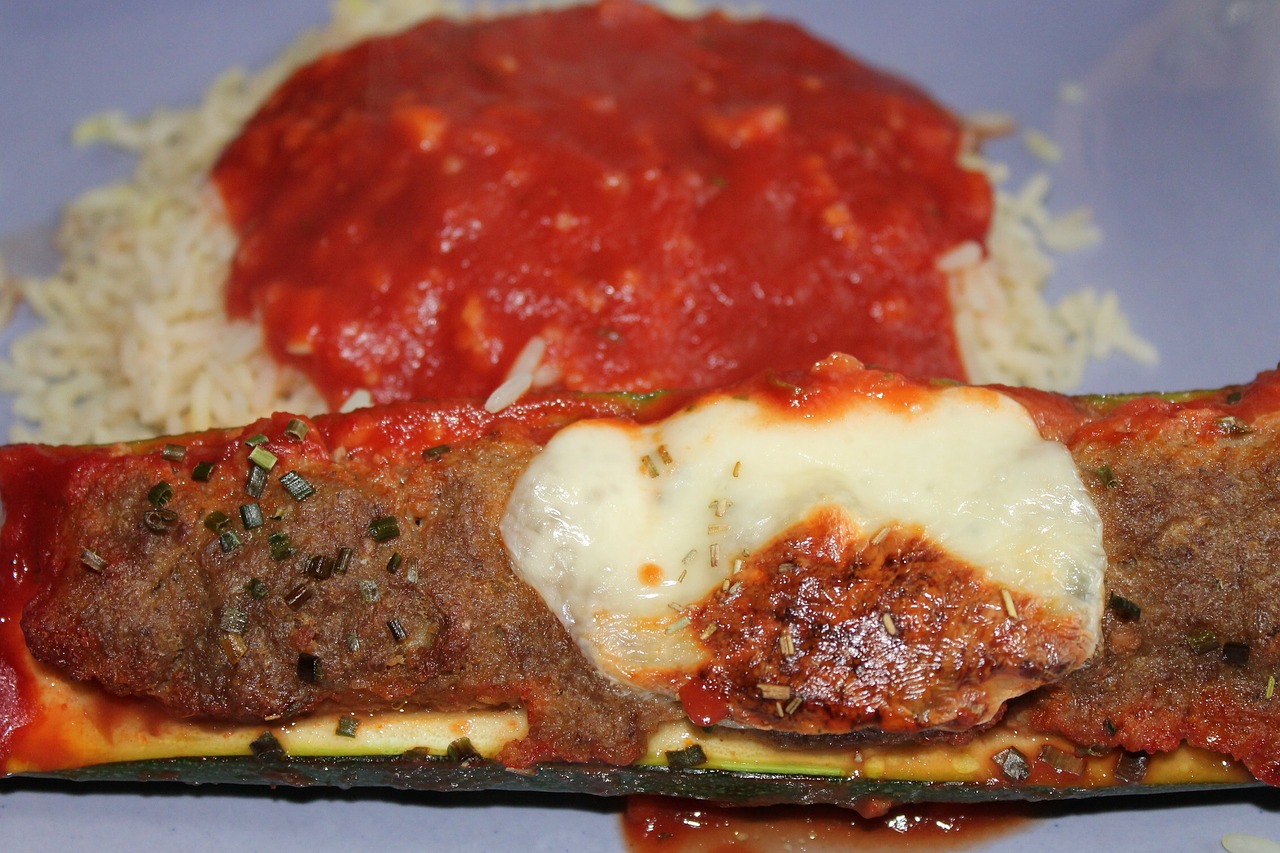 stuffed zucchini rice tomato sauce free photo