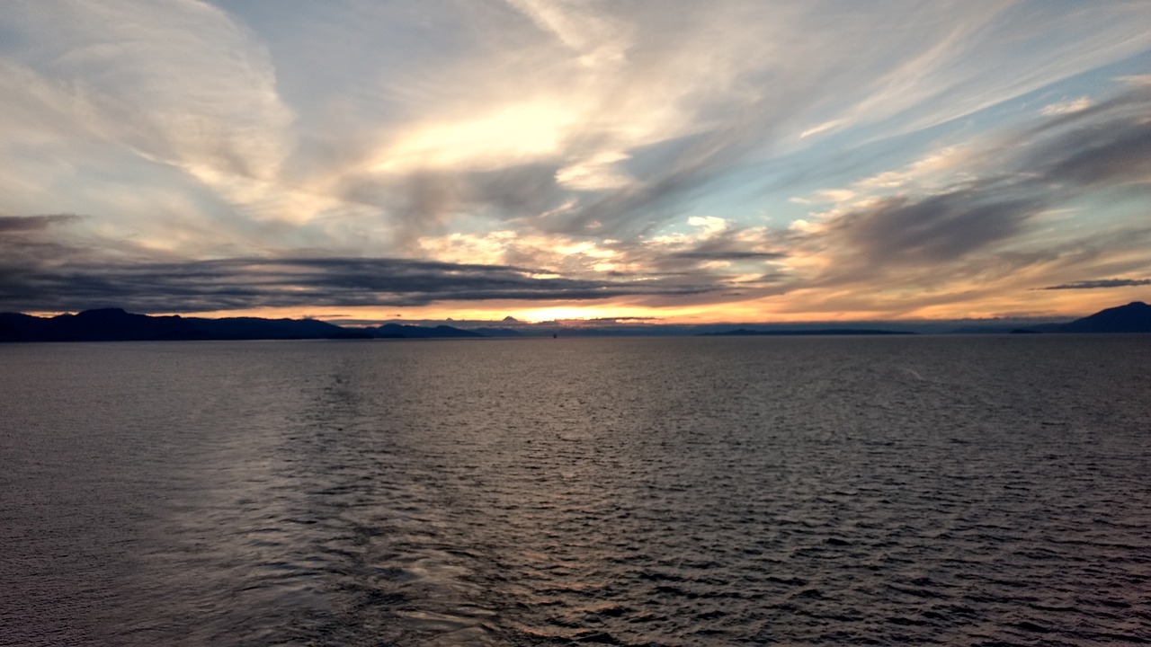 sun  sea and clouds  alaska free photo