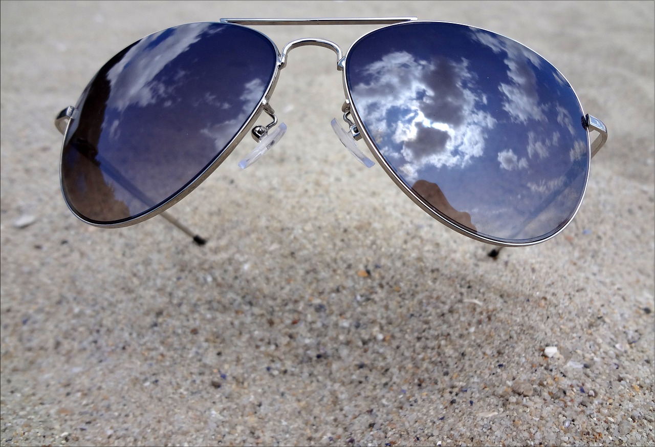 sun glasses sand reflection free photo