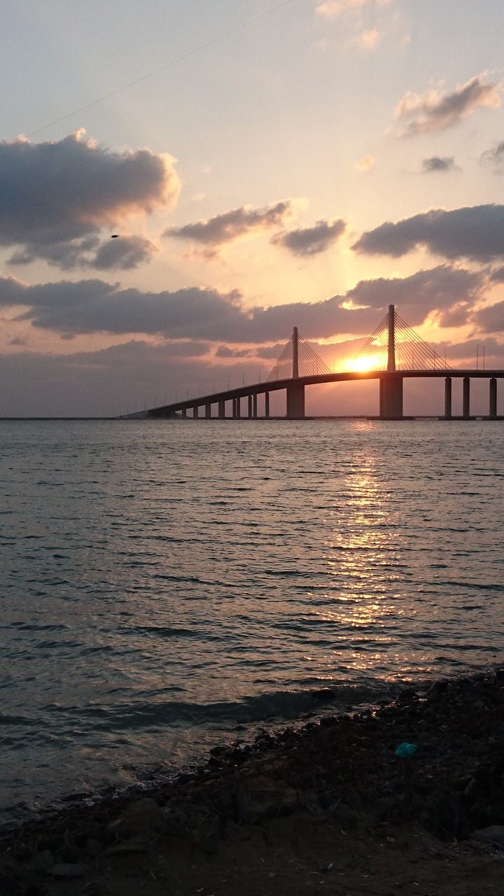 sun setting bridge dusk free photo