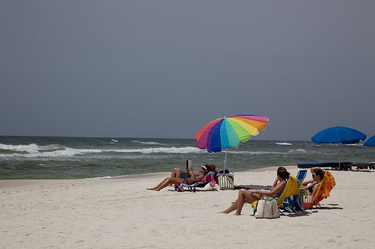 sunbathers beach sand free photo