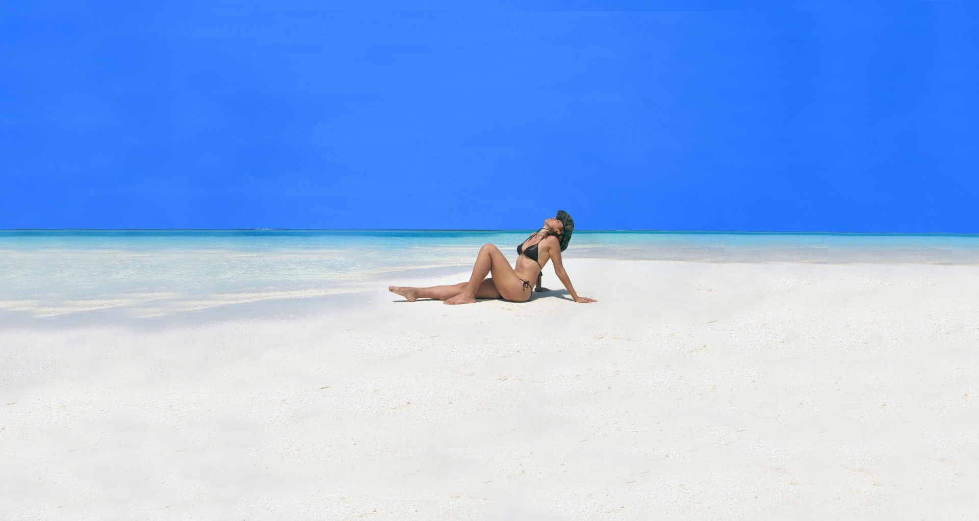 sunbathing beach white sand free photo